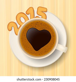 Coffee cup with saucer and cookies in form of numbers, form together the number 2015, on wooden background