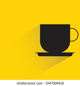 coffee cup with shadow on yellow background