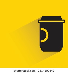 coffee cup with shadow on yellow background