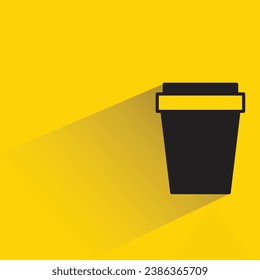 coffee cup with shadow on yellow background