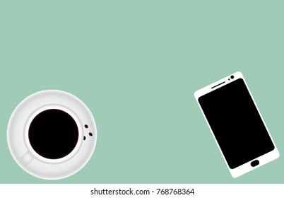 coffee cup and smartphone top view on green background