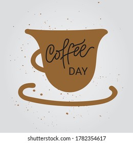 Coffee Day hand drawn lettering.Hand drawn lettering phrase with coffee cup and textured background. Modern calligraphy. Phrase for card or poster.