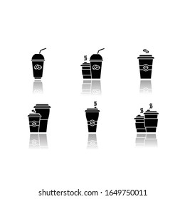 Coffee to go drop shadow black glyph icons set. Disposable plastic cups with caffeine drinks. Take out cold and hot beverages. Latte, cappuccino mugs. Isolated vector illustrations on white space