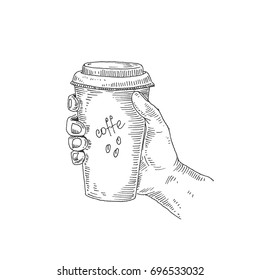 Coffee in hand. Hot drink. Vector sketch. Drawn by hand.