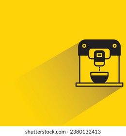 coffee machine with shadow on yellow background