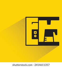 coffee machine with shadow on yellow background