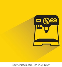 coffee machine with shadow on yellow background