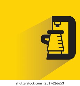 coffee maker icon with shadow on yellow background