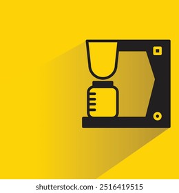 coffee maker with shadow on yellow background