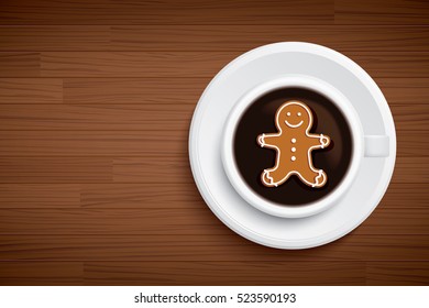 coffee mug with gingerbread man shape on brown wood table
