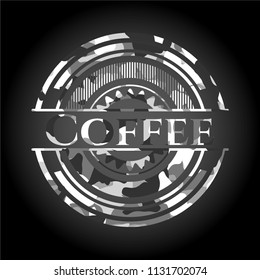 Coffee on grey camo texture