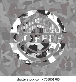 Coffee on grey camouflage texture