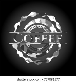 Coffee on grey camouflaged texture