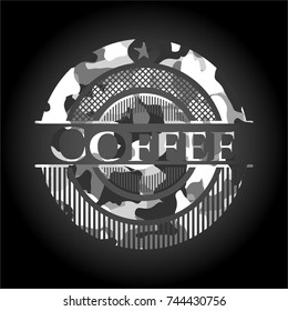 Coffee on grey camouflaged texture