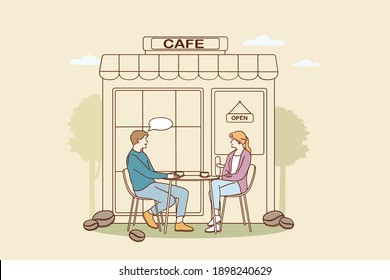 Coffee shop and cafeteria concept. Young smiling couple cartoon characters sitting outdoors drinking coffee and chatting in cafeteria vector illustration