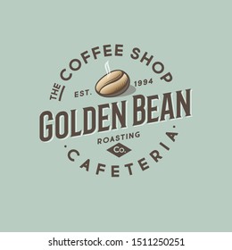 Coffee shop and cafeteria logo. One golden coffee beans with letters in a circle frame. 