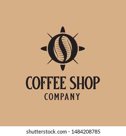 Coffee shop logo design with coffee bean made from horns inside circle shapes with arrow like compass