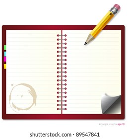 Coffee stains on Notebook with pencil