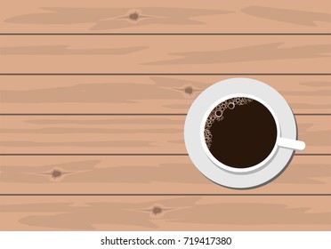 Coffee in white cup on wooden table