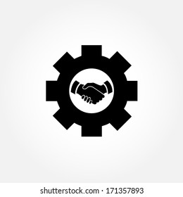 Cog with handshaking sign in the middle