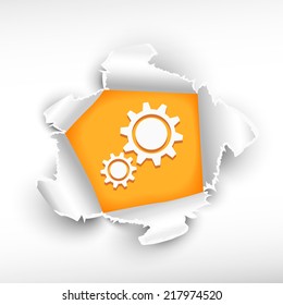 Cogwheel and breakthrough paper hole with ragged edges with a space for your message. 