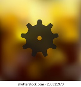 cogwheel icon on blurred background