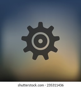 cogwheel icon on blurred background