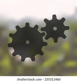 cogwheel icon on blurred background