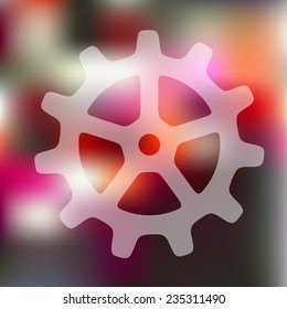 cogwheel icon on blurred background