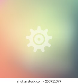 cogwheel icon on blurred background