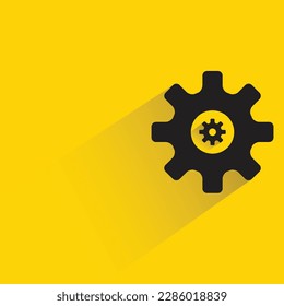cogwheel with shadow on yellow background