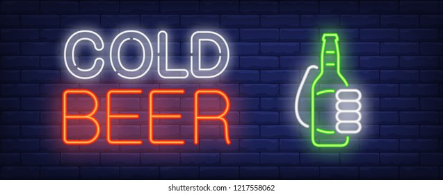 Cold beer neon sign. Glowing neon inscription with beer bottle in hand on dark blue brick background. Can be used for shops, night advertisements, bars, street signs