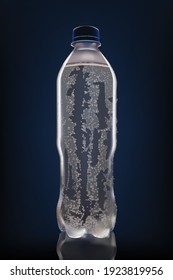 cold bottle of water with water drops