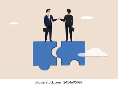 Collaborate, together or teamwork support each other concept, partnership and agreement to help business success, success businessmen finish deal and handshake on jigsaw puzzle.