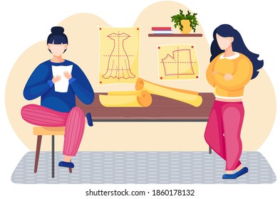 Colleagues in the atelier are discussing the model of future garment. Professional tailoring studio. Sewing clothes to order. Women are planning the pattern of dress. Young people work with paper