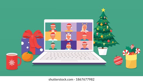 Colleagues talk to each other on a laptop screen via video call. Men and women in New Year's hats meet by videoconference discussing New Year's holidays, Christmas tree decorations, gifts.