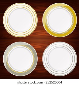 Collection of 4 white plates with gold and silver lines. Vector image can be used for food menu or posters design, web or other crafts.