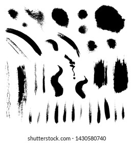 A collection of black brush strokes and spots in a white background. 