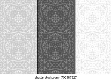 Collection of black, gray and white floral ornaments. Set of seamless patterns for wallpapers and fabrics. Vector illustration