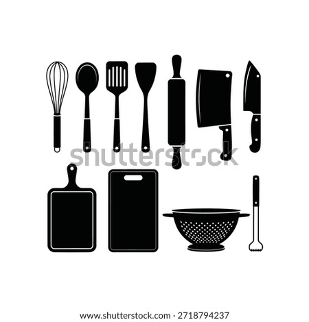A collection of black kitchen utensils and cutting boards displayed neatly