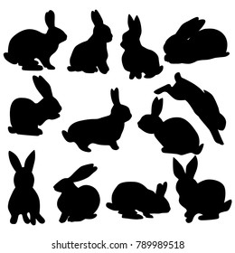 Collection of black silhouettes of rabbits isolated on a white background. Easter rabbits in various poses.