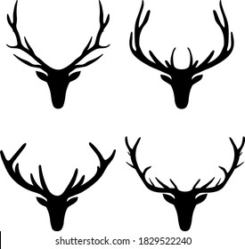 Collection of black vector silhouettes of deer heads with big antlers