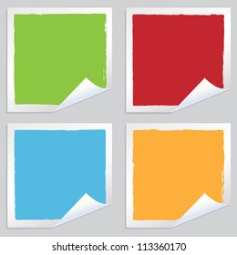 collection of blank square stickers in red, green, blue and yellow