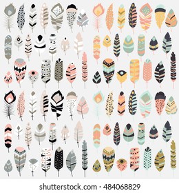 Collection of boho vintage tribal ethnic hand drawn colorful feathers, vector illustration