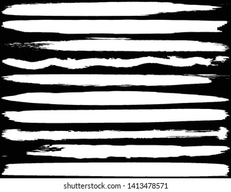 Collection of brush strokes grunge style. Abstract traces from the rollers. White stripes on a black background. Vector abstract elements