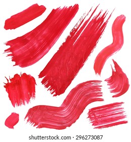 collection of brushes, red smears and strokes