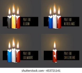 Collection of candle flags for remembering day. Burning candles in colors of flag isolated on black background. Pray for Belgium, Netherlands, Luxembourg, Switzerland