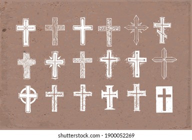 Collection of christian crosses. Doodle sketch illustration on brown parcel paper background.