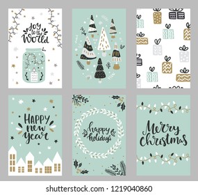 Collection of christmas greeting cards with hand lettering and hand drawn winter holiday and christmas elements and floral arrangement