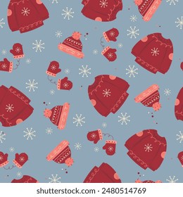 A collection of Christmas patterns. Seamless pattern with Christmas clothes on blue backgrounds